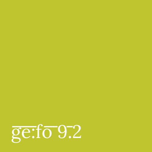 Yellow-green square with issue number